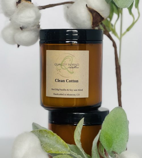 Clean cotton scented candle displayed with cotton plant
